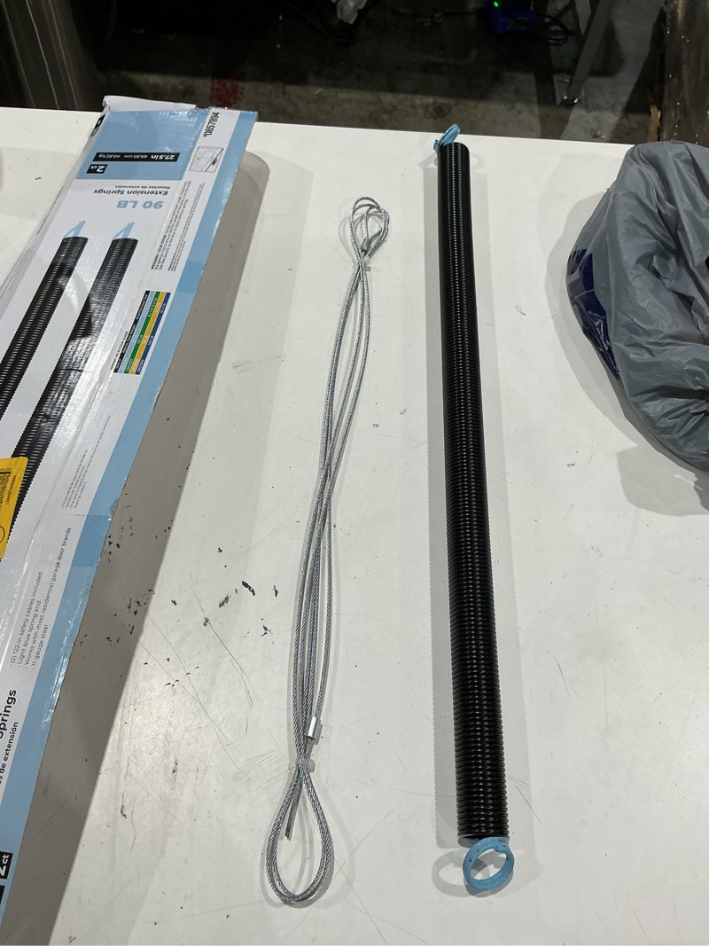 Condition photo showing As Is for incomplet)))reliabilt 90 lbs 2-pack black steel garage door extension spring and safety cable