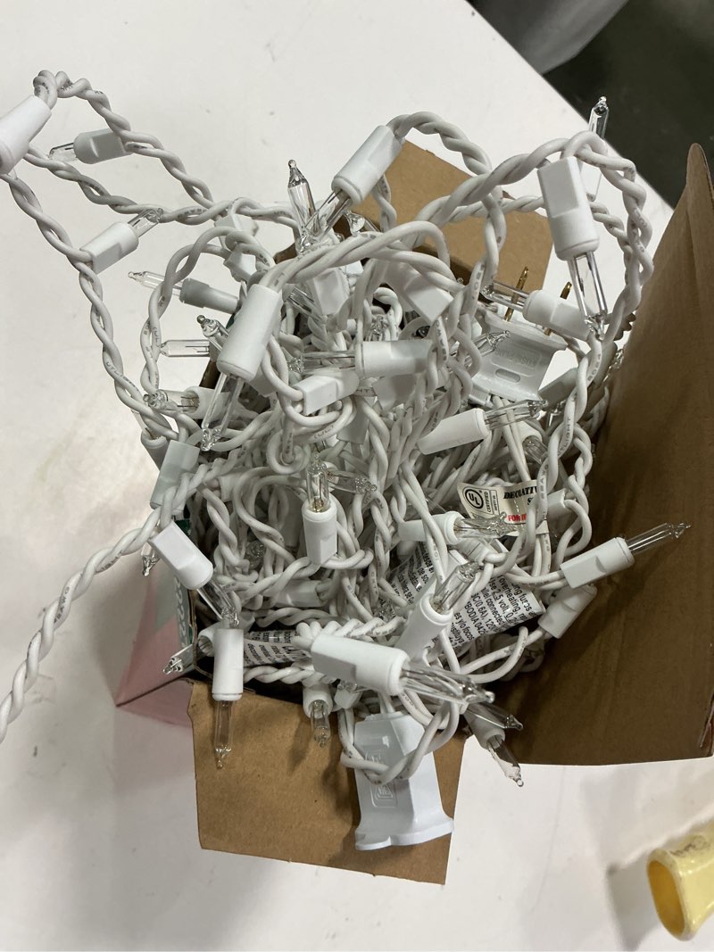 Condition photo showing As Is for 6022227 holiday 300ct clear icicle lights