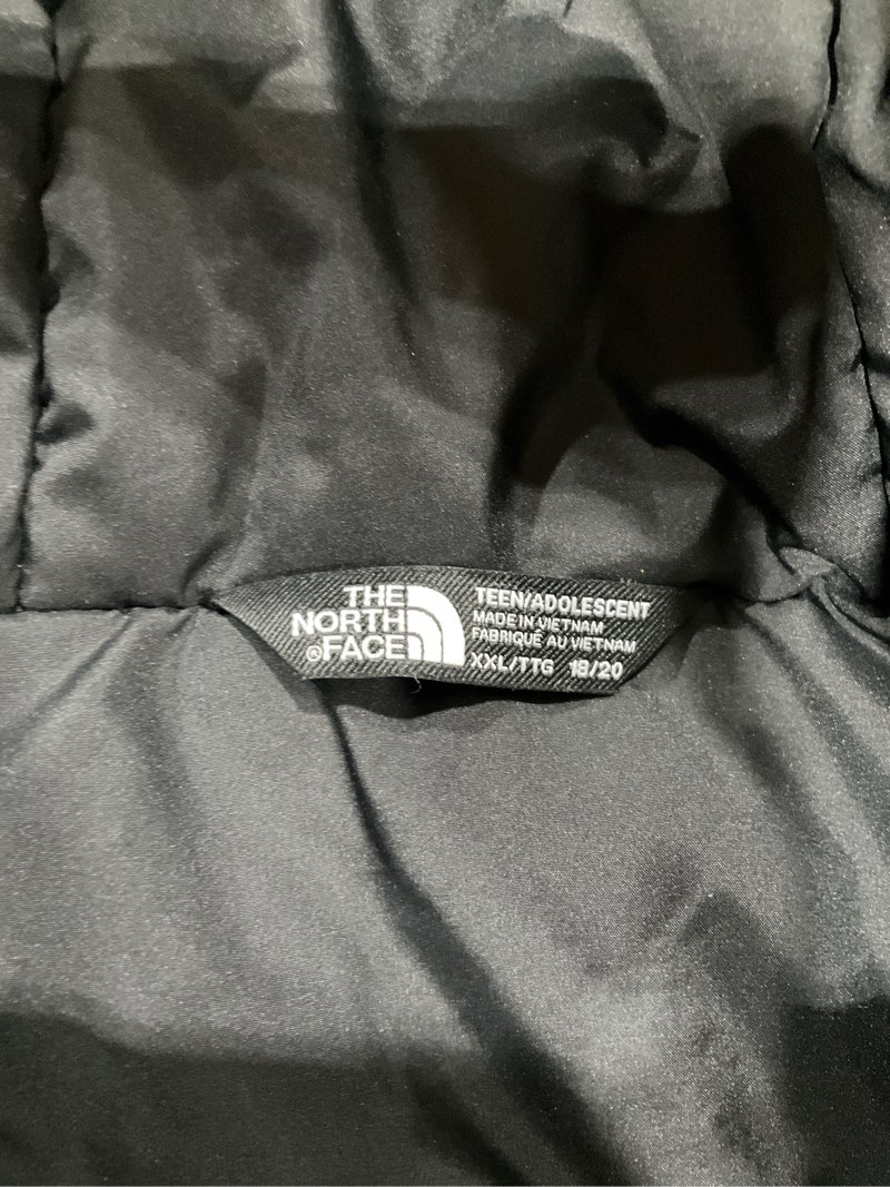 Condition photo showing As Is for The north face jacket for teens, XXL