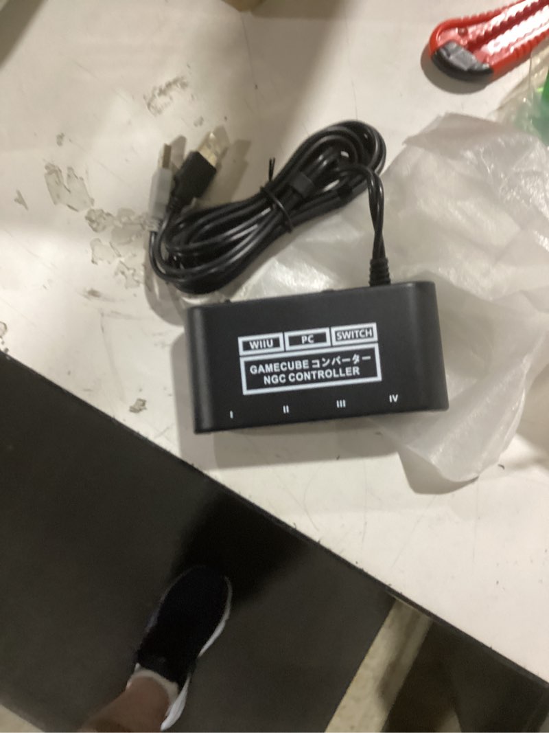 Condition photo showing As Is for gamecube controller adapter. super smash bros gamecube adapter for wii u, pc, switch. no driver need and easy to use. 4 port black gamecube adapter(improved version)