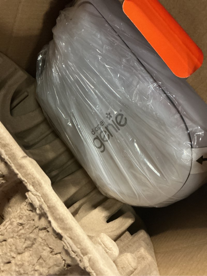 Condition photo showing New/Like New for diaper genie platinum pail (lily white) is made in durable stainless steel and includes 1 easy roll refill with 18 bags that can last up to 5 months.