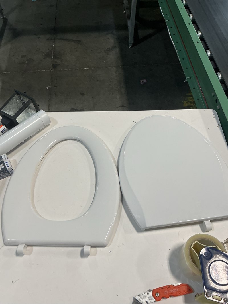 Condition photo showing As Is for american standard bedminster wood white elongated soft close toilet seat