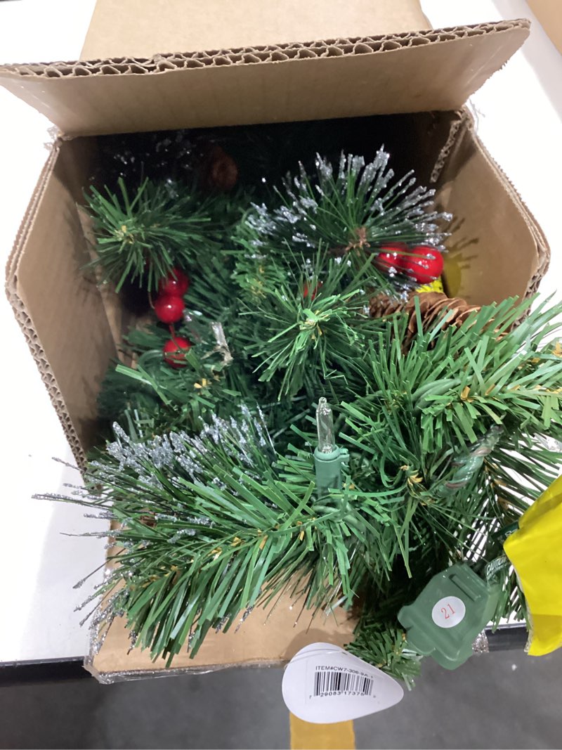 Condition photo showing Good Condition for national tree company 9 ft pre-lit crestwood spruce artificial christmas garland, christmas decoration with glitter, pinecones, red berries, 50 clear lights, 180 tips, green plug in tree