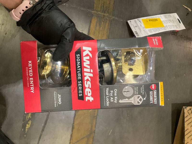 Condition photo showing As Is for kwikset juno keyed entry knob featuring smartkey security™ in pb