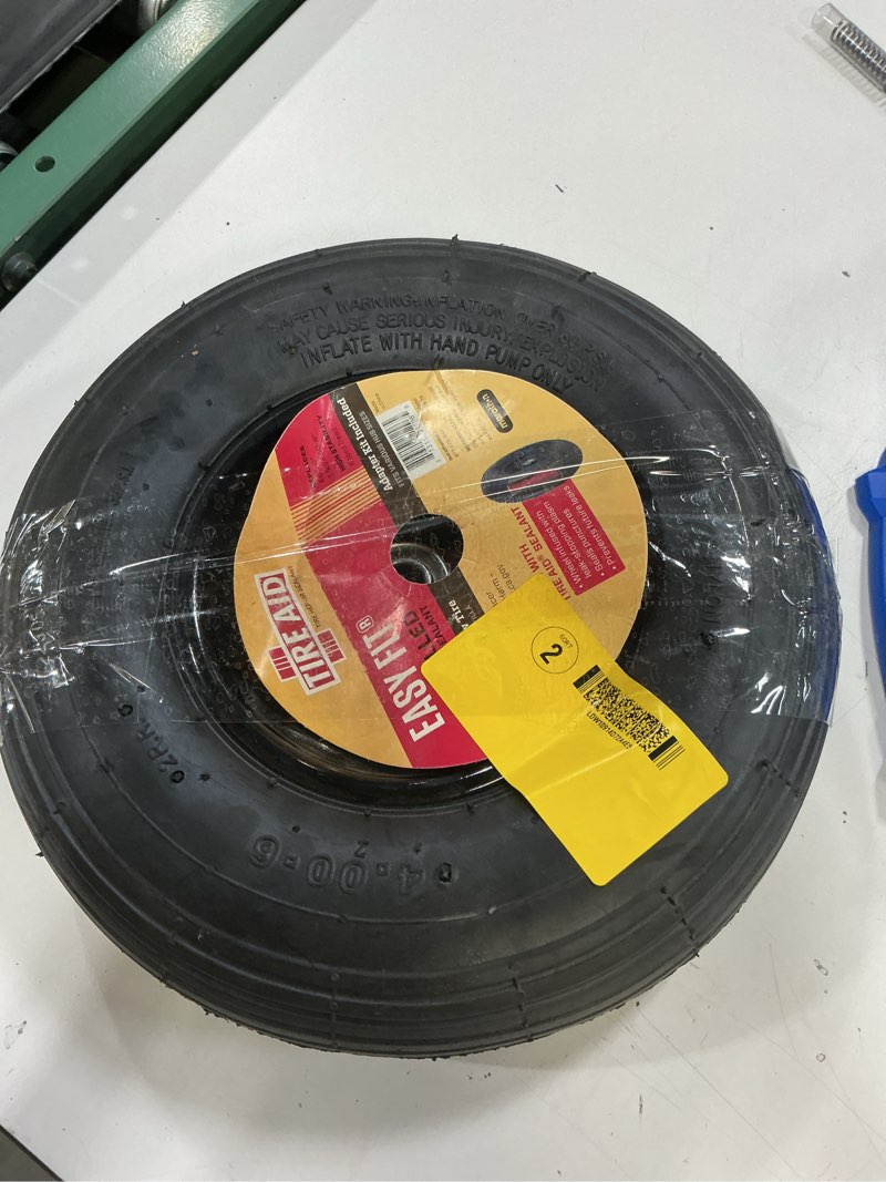 Condition photo showing As Is for marathon easy fit sealant filled, pneumatic (air-filled) 4-6 tire and wheel assembly, wheelbarrow/cart use, ribbed tread