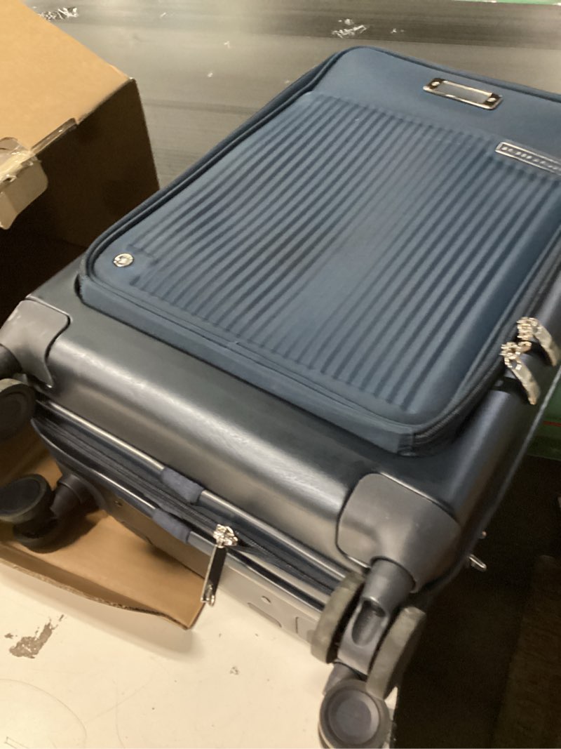 Condition photo showing Good Condition for Briggs & Riley Essential 22" Carry-On Expandable Spinner - Carry On Luggage for Travel, Suitcases with Wheels, Hardside Rolling Bag for Men & Women, Front Pocket - Sympatico Collection, Navy 22" Essential Carry-On Front Pocket Navy