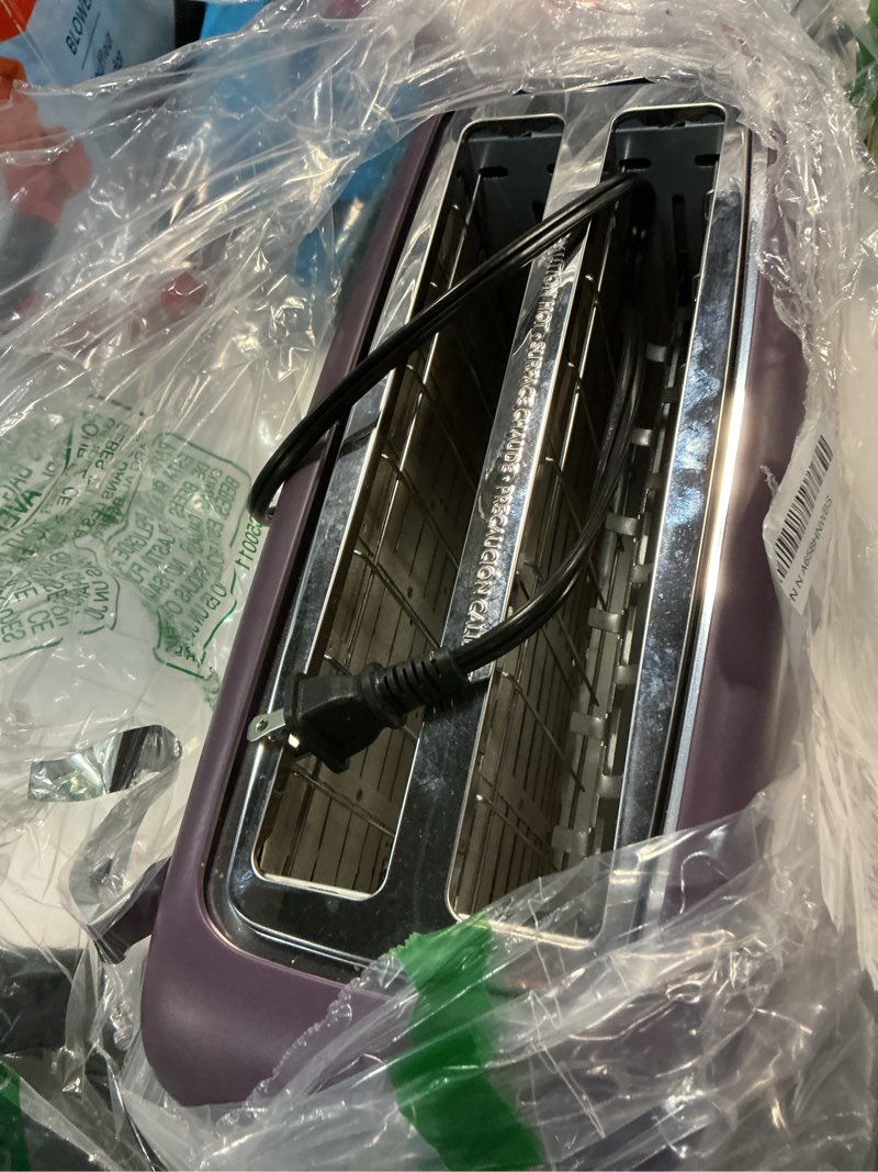 Condition photo showing As Is for bella 4 Slice Slim Toaster, Fits-anywhere™ Kitchenware, 6 Setting Shade Control with Reheat & Cancel Buttons, Fits Sourdough, 10” Long Slot, Anti Jam & Auto Shutoff, 900 Watt, Plum 4 Slice Plum