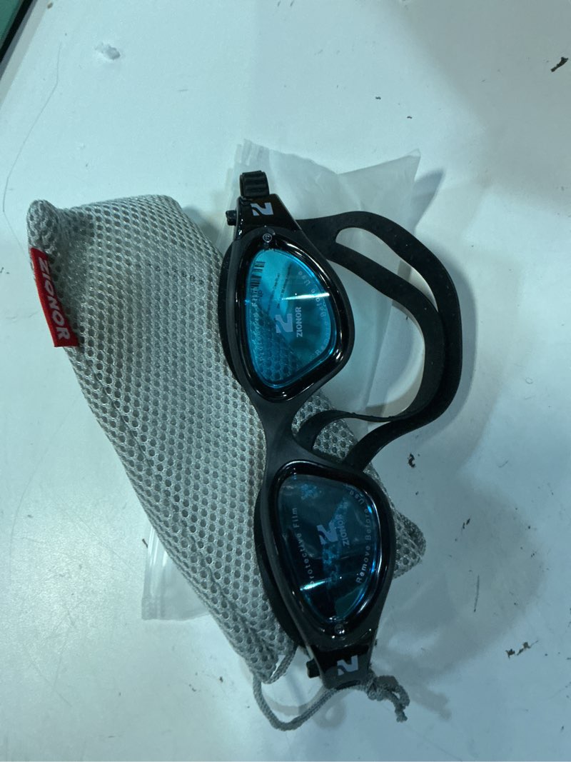 Condition photo showing As Is for zionor swim goggles, g1 se swimming goggles anti-fog for adult men women a5-clear blue lens black frame