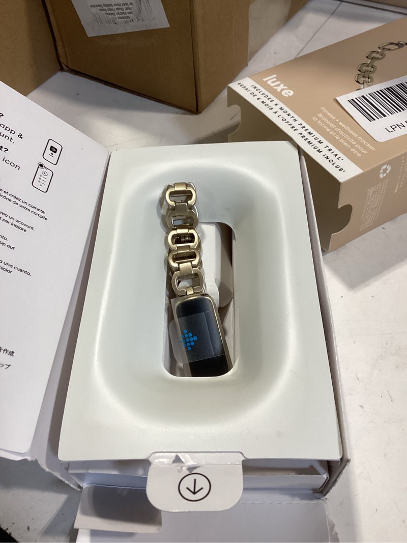 Condition photo showing Good Condition for fitbit luxe special edition fitness and wellness tracker, gorjana soft gold stainless steel parker link bracelet, one size (s & l peony classic bands included) gold tracker