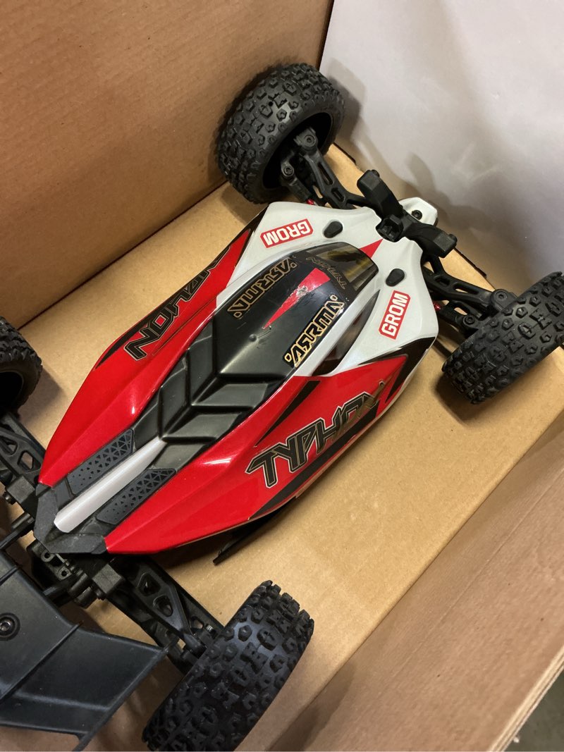 Condition photo showing As Is for arrma rc car typhon grom 4x4 smart small scale buggy rtr with battery & charger red/white ara2106t2
