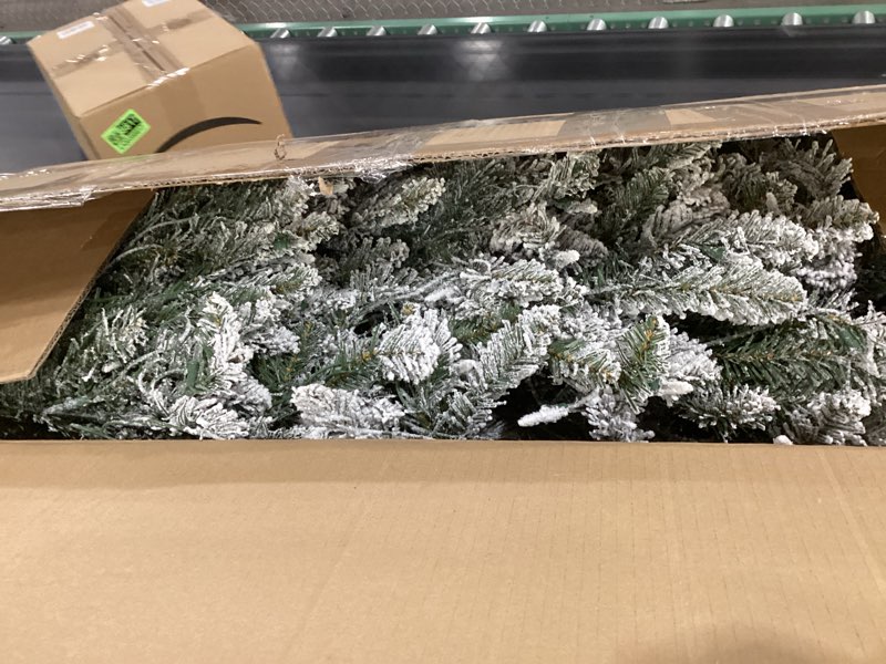 Condition photo showing Good Condition for Puleo International 7.5 Foot Pre-Lit Slim Flocked Fraser Fir Artificial Christmas Tree with 500 UL Listed Clear Lights 7.5' Slim Flocked Fraser Fir with 500 Clear Lights Christmas Tree