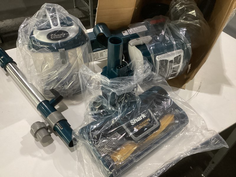 Condition photo showing As Is for Shark NV352 Navigator Lift Away Upright Vacuum, Hepa Filter, Anti-Allergen Technology, Swivel Steering, Ideal for Carpet, Stairs, & Bare Floors, with Wide Upholstery & Crevice Tools, Lavender Navigator, NOT TESTED, AS IS