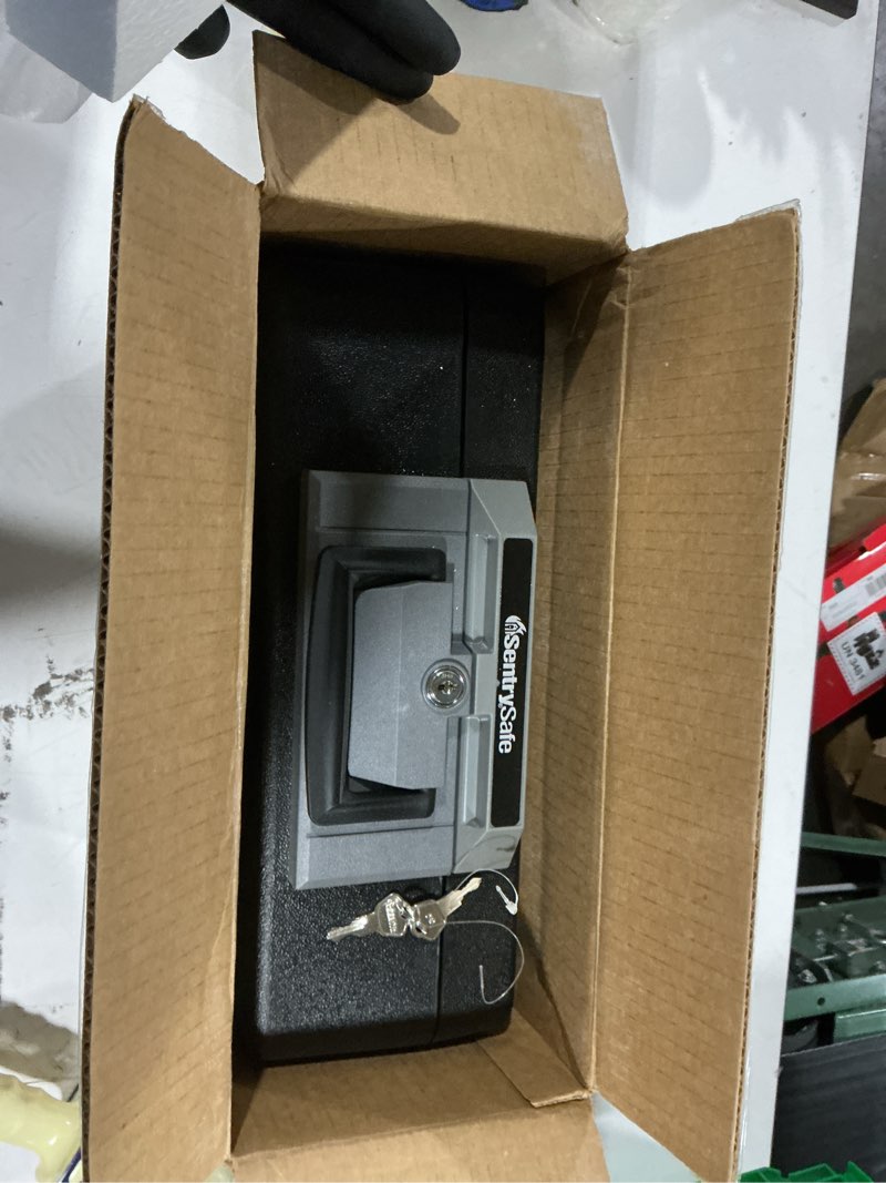 Condition photo showing Good Condition for sentrysafe fireproof safe box with key lock, chest safe with carrying handle to secure money, jewelry, documents, 0.25 cubic feet, 6.3 x 15.3 x 12.1 inches, 1160 fire resistant box 0.25 cu. ft.