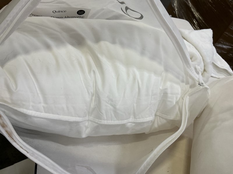 Condition photo showing As Is for premium down alternative pillow, standard, medium/firm