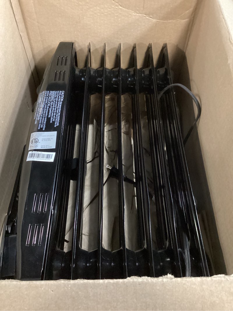 Condition photo showing As Is for pelonis radiator heater for large space, electric oil filled radiator, dual knobs, 1500w, quiet space heater, 3 modes, tip-over protection classic black