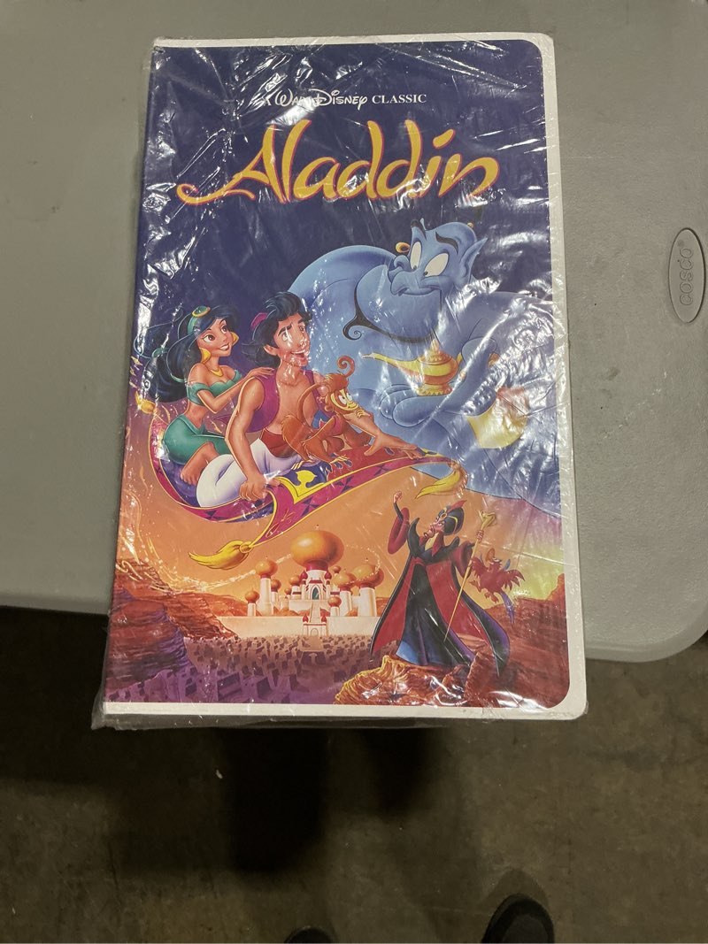 Condition photo showing New/Like New for disney aladdin classic retro vhs boxed silk touch throw, 50" x 70" sealed new