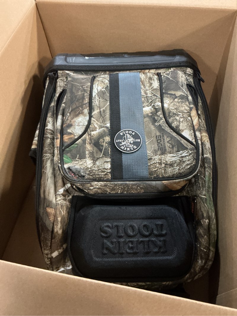 Condition photo showing As Is for Klein Tools 62800BPCAMO Backpack Tool Bag, Tradesman Pro Extra-Large 40-Pocket Jobsite Camo Tool Backpack with Molded Bottom, Charging Port