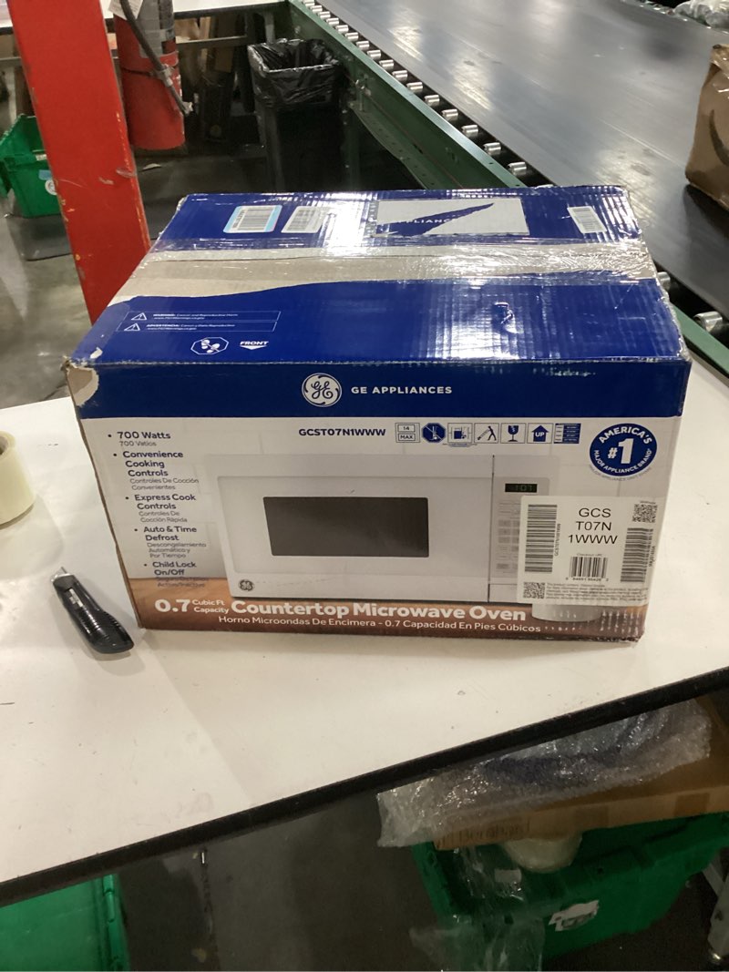 Condition photo showing New/Like New for ge countertop microwave oven, compact 0.7 cubic ft., 700-watt capacity, 6 auto cooking settings, child-lock technology, kitchen essentials for the countertop, dorm room or apartment, white 0.7 cu.ft. white