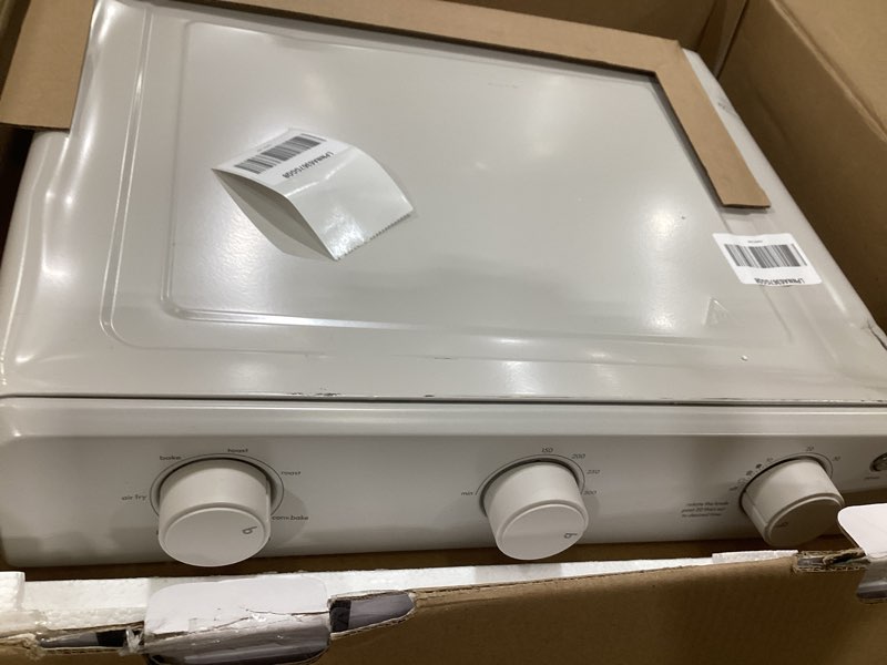 Condition photo showing As Is for bella air fry toaster oven, 7 preset cooking options, dishwasher-safe evergood coated trays included, 60-minute auto shutoff w audible timer, power indicator light, 1700 watt, oatmilk