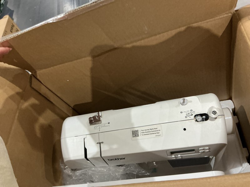Condition photo showing As Is for brother cs7000x computerized sewing and quilting machine, 70 built-in stitches, lcd display, wide table, 10 included feet, white