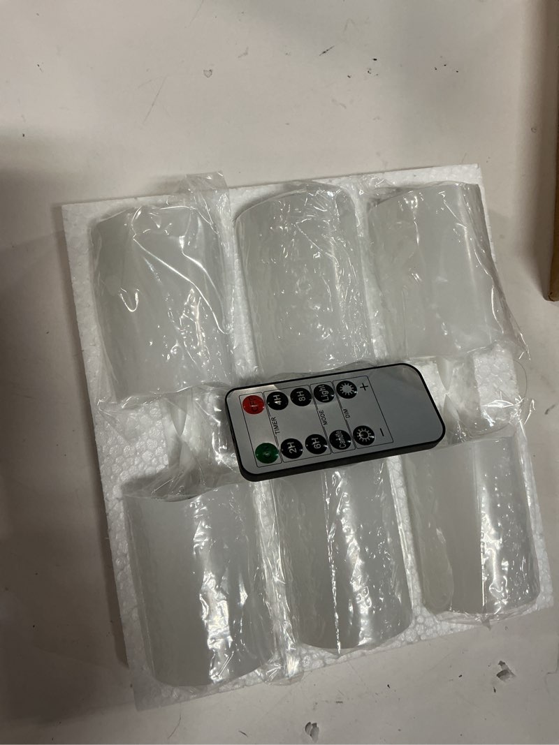 Condition photo showing New/Like New for eywamage white flameless votive candles with remote batteries, 2x3 inch flickering small led wax pillar candles 6 pack