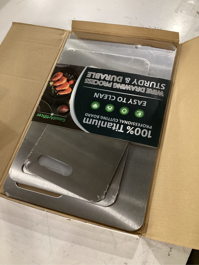 Condition photo showing Good Condition for titanium cutting boards set of 3, 100% pure titanium kitchen cutting board, double-sided non-toxic cutting board, ideal for slicing and dicing meats, features handle, dishwasher safe silver 16"l*10"w(s+m+l)