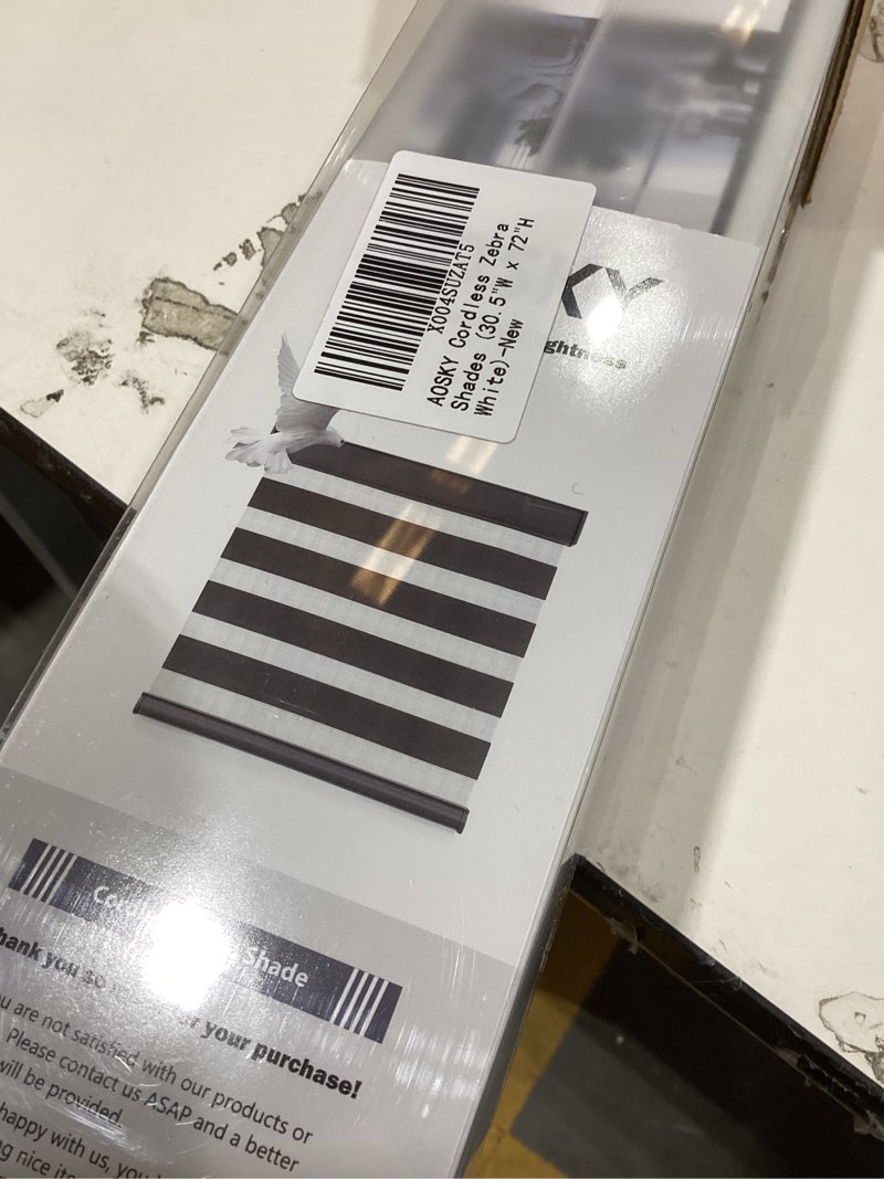 Condition photo showing New/Like New for Persilux Cordless Zebra Blinds for Windows, Roller Shades for Windows (34.5" W x 64" H, White) Dual Layer Fabric for Day and Night,Room Darkening Shades for Home, Office, Bedroom and Living Room