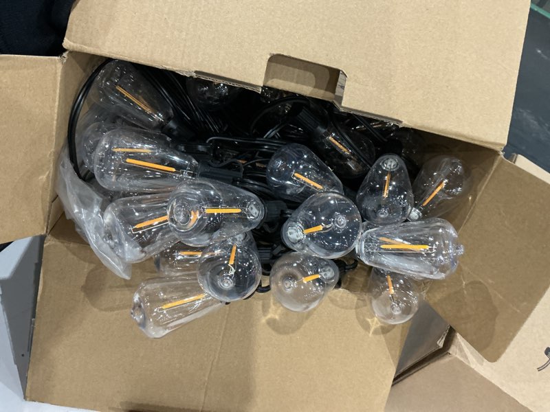 Condition photo showing Good Condition for brightever led outdoor string lights 100ft patio lights with 52 shatterproof st38 vintage edison bulbs, outside hanging light waterproof for porch, deck, garden, backyard, balcony, 2700k dimmable black wire 100ft-warm white