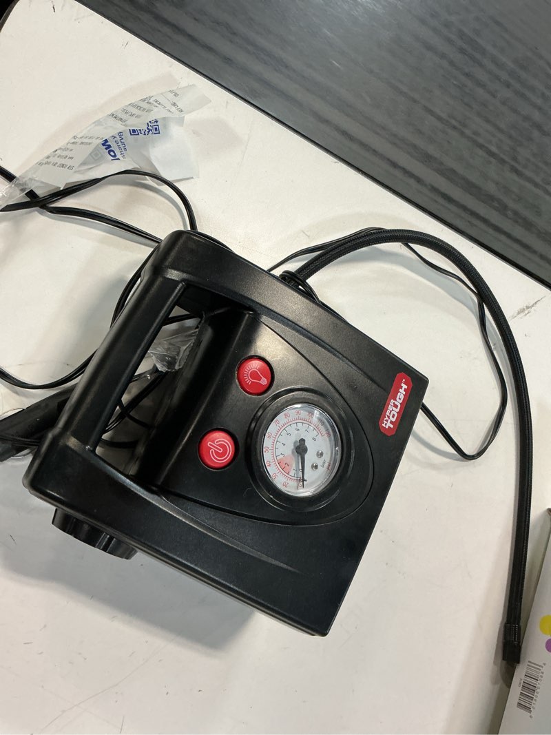 Condition photo showing As Is for hyper tough dc12v standard tire inflator & tire pump