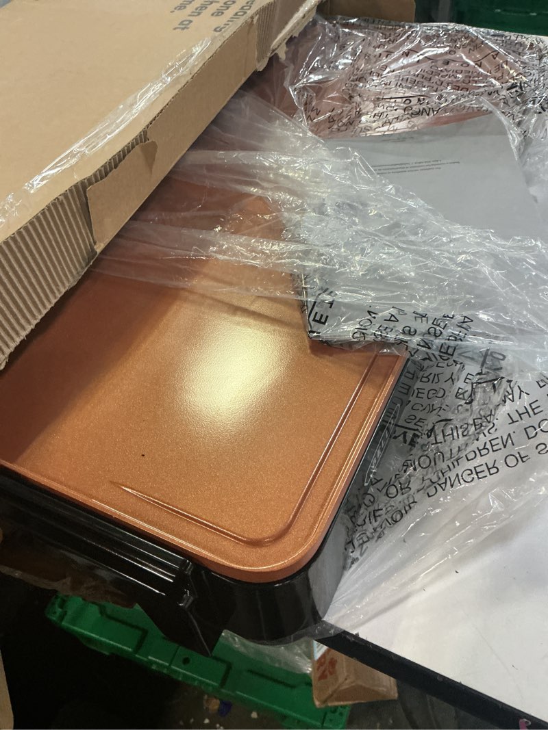 Condition photo showing As Is for bella XL Electric Ceramic Titanium Griddle, Make 15 Eggs At Once, Healthy-Eco Non-stick Coating, Hassle-Free Clean Up, Large Submersible Cooking Surface, 12" x 22", Copper/Black 12" x 22" Copper