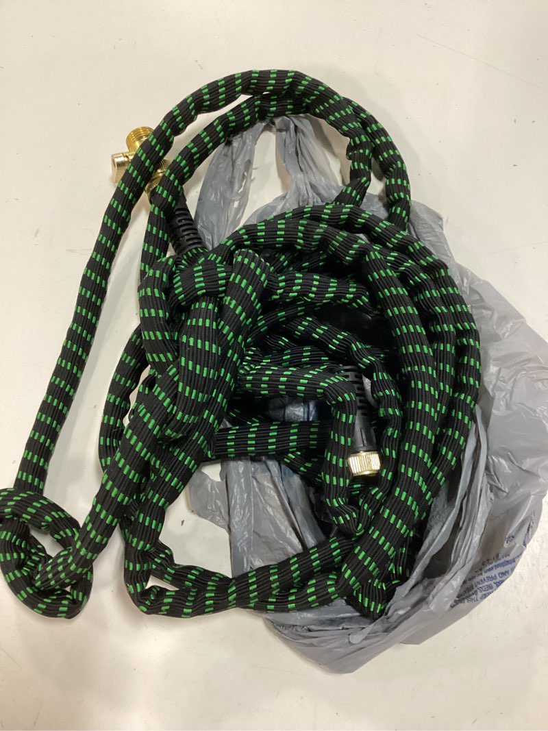 Condition photo showing As Is for zero g garden hose 25ft