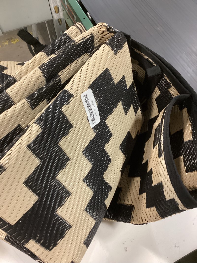 Condition photo showing As Is for SAND MINE Reversible Mats, Plastic Straw Rug, Modern Area Rug, Large Floor Mat and Rug for Outdoors, RV, Patio, Backyard, Deck, Picnic, Beach, Trailer, Camping, Black & Beige, 6' x 9' Black & Beige 6' x 9'