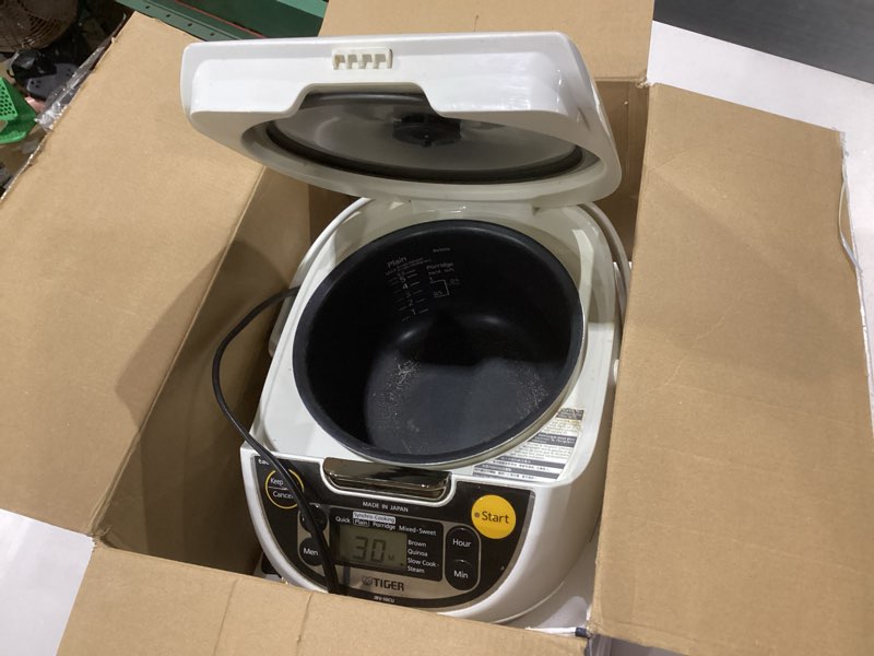 Condition photo showing As Is for tiger jax-t10u-k 5.5-cup (uncooked) micom rice cooker and warmer with tacook food steamer cooking tray technology and 10 auto-cook settings, stainless steel black, not tested,