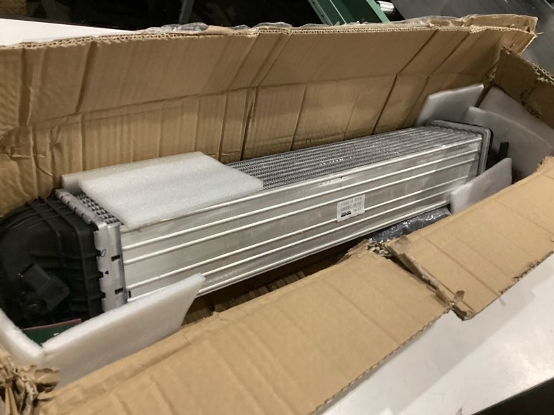 Condition photo showing As Is for dorman 918-961 intercooler compatible with select chevrolet models