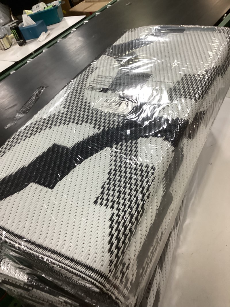 Condition photo showing New/Like New for OLANLY Reversible Outdoor Rug 9x12 ft Clearance, Waterproof Outdoor Plastic Straw Rug with Interlacing Pattern, RV Mat for Patio, Camping, Balcony, Deck, Backyard, Black & White Black & White Braided 9' x 12' (Rectangular)