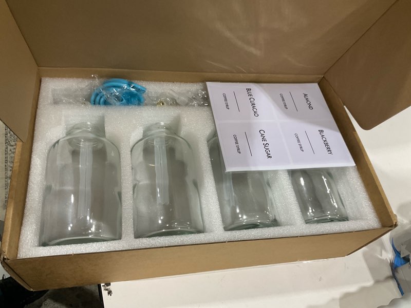 Condition photo showing Good Condition for 16.9 oz (500 ml) Coffee Syrup Dispenser Set- 4 Glass Bottles with Gold Pumper and Syrup Labels - Precise Dispensing and Stylish Addition to Coffee Shop, Cafe or Home Bar 4 Pack Gold