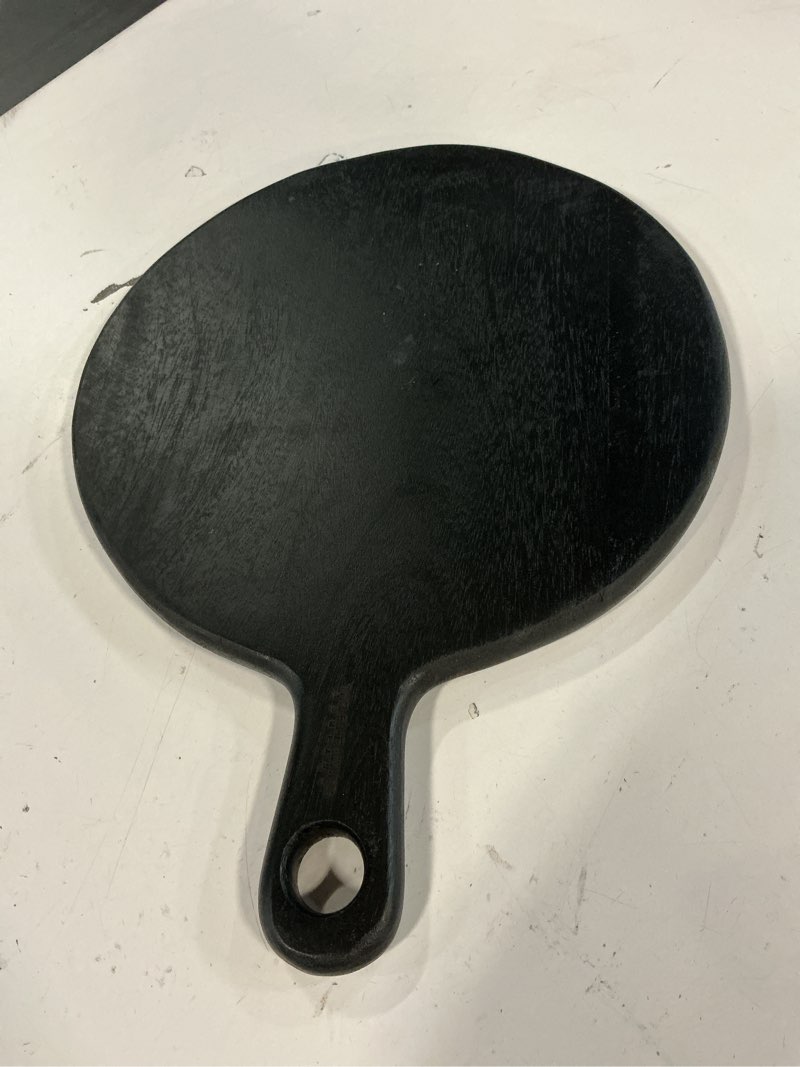 Condition photo showing Good Condition for The Fine Living Co. Black Charcuterie Board, Round Paddle Board with Long Handle, Mango Wood Serving Platter for Meat, Pizza, Bread, Food-Grade Wooden Serving Trays, 16”x12”, 0.6" Thick Black Round