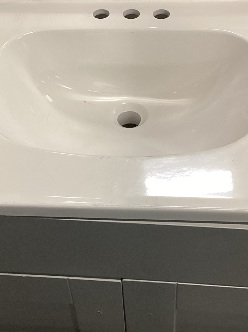 Condition photo showing As Is for project source dover 24-in light gray single sink bathroom vanity with white cultured marble top