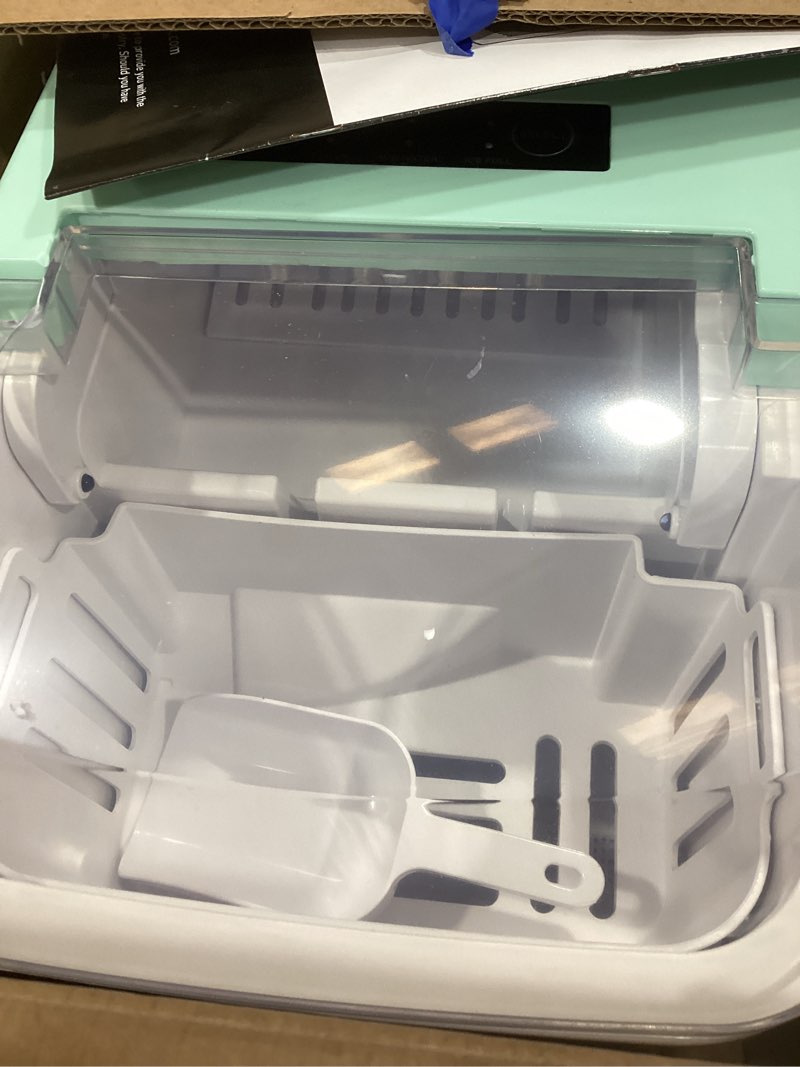 Condition photo showing As Is for newbulig ice makers countertop with handle, portable ice machine, 9 bullet ice cubes in 6 mins, 26lbs in 24hrs, auto-cleaning, with basket and scoop, for home, kitchen, rv, camping,green green 12.3"*11.5"*8.5"