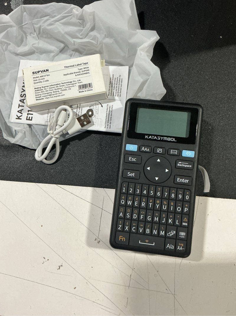 Condition photo showing As Is for supvan e11 bluetooth label maker machine with 4 tapes, support keyboard & app with 30+ fonts and 660+ icons, rechargeable inkless labeler for home, kitchen, office, school, organization, black machine + 4 tapes (set 2)