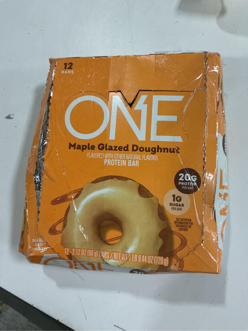Condition photo showing New/Like New for BB: 10 2026 ONE Protein Bars, Maple Glazed Doughnut, Gluten Free with 20g Protein and 1g Sugar, Pantry Staples, 2.12 oz (12 Count)