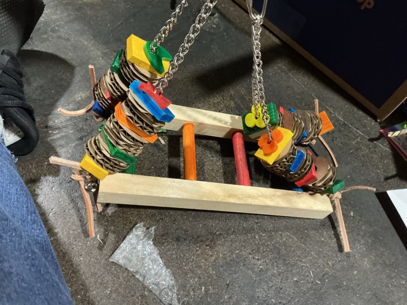Condition photo showing Good Condition for Super Bird Creations SB748 Flying Trapeze Bird Toy for Conures, Quakers, Cockatiels, Parrots, Senegals, Multi-Colored Chain, Seagrass Mat, Enrichment Toy - Medium Bird Size, 14" x 13" x 12"