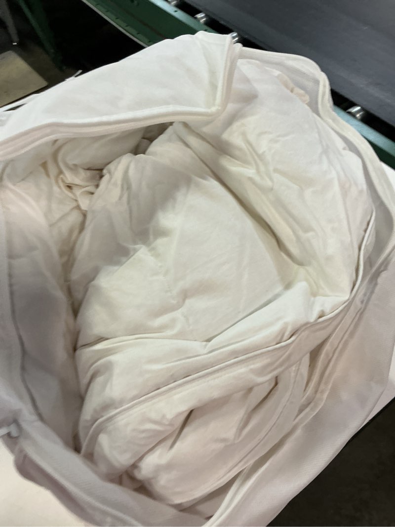 Condition photo showing As Is for premium down comforter, king/cal king, down