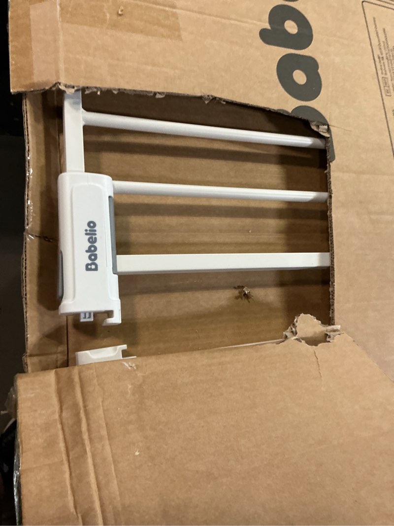 Condition photo showing As Is for BABELIO Baby Gate for Doorways and Stairs, 36-41" Pet Gate with Wide Walk Thru Door and Lock Indicator, No Drill Pressure Mounted Safety Gate with Double Lock and Self-Closing, White White 36-41"W, 30"H