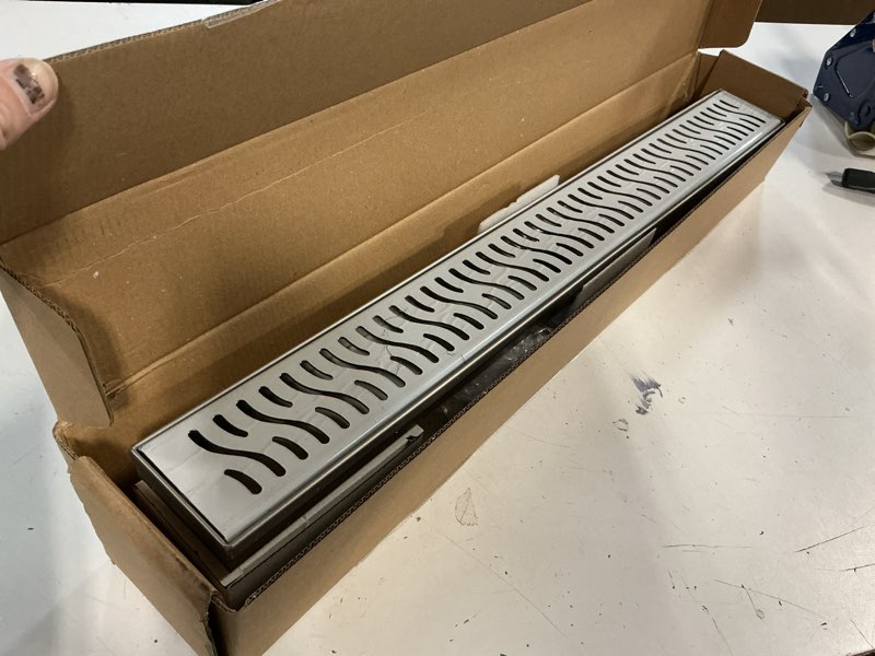 Condition photo showing Good Condition for 24 inch linear shower drain, brushed nickel shower drain, removable grate, 304 stainless steel, easy to install and clean for bathrooms (drain base not included), lsd-51a-24s brushed nickel 24 inch