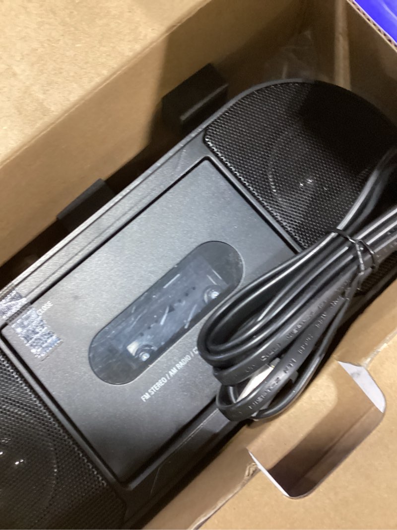 Condition photo showing As Is for onn cassette boombox with bluetooth, cd, mp3 and radio features