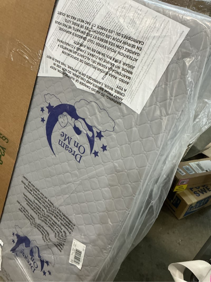 Condition photo showing New/Like New for dream on me asheville 4” firm fiber crib & toddler bed mattress, dual-sided, waterproof, greenguard gold certified, lightweight, reversible design, grey embossed vinyl cover grey mattress