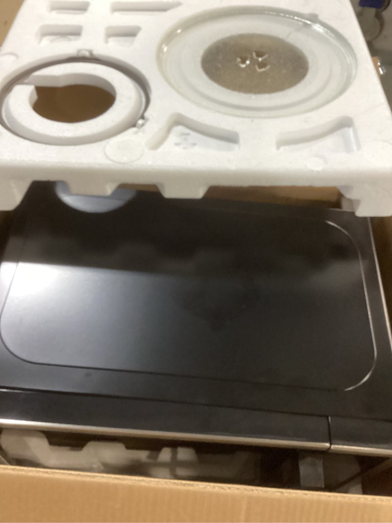 Condition photo showing Good Condition for Chefman Countertop Microwave Oven 0.7 Cu. Ft. Digital Stainless Steel Microwave 700 Watts with 6 Auto Menus, 10 Power Levels, Eco Mode, Memory, Mute Function, Child Safety Lock, Easy Clean