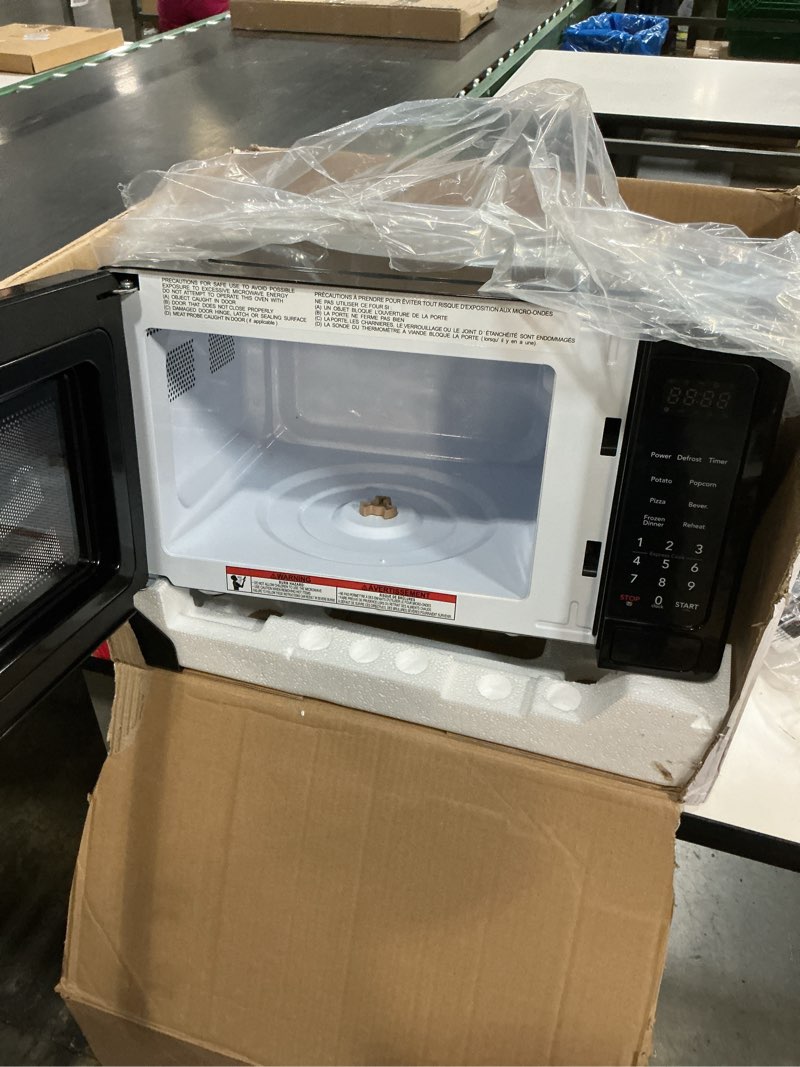 Condition photo showing Good Condition for frigidaire 0.7 cu. ft. new countertop microwave oven - black