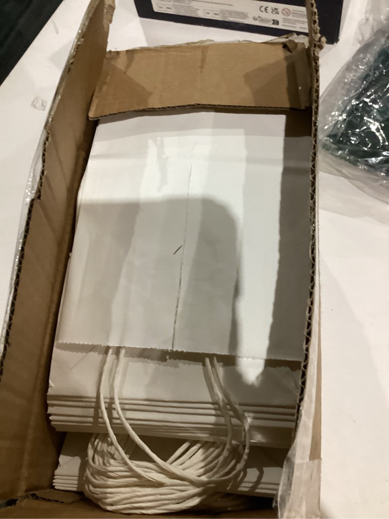 Condition photo showing As Is for SUNEE 100 Pcs Gift Bags with Handles, 5.5x3.3x8 Inchs Small White Paper Gift Bags Bulk for Retail, Birthday Wedding Party Favors, Small Business and Paper Shopping Bag - White 100 Count (Pack of 1) White